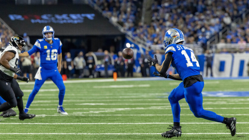 Detroit Lions quarterback Jared Goff throws to wide receiver Amon-Ra St. Brown