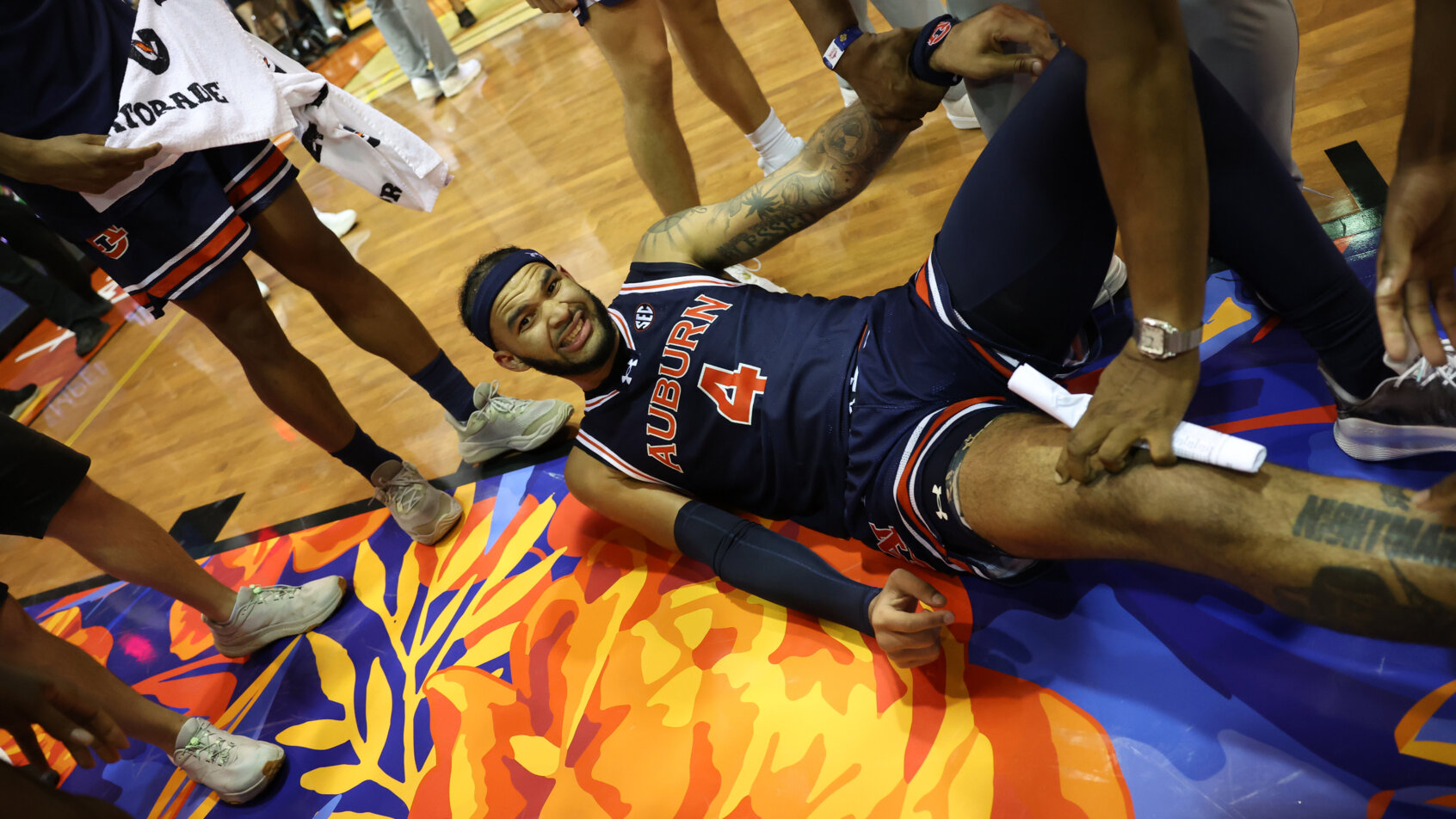 Auburn Tigers forward Johni Broome laying on the court