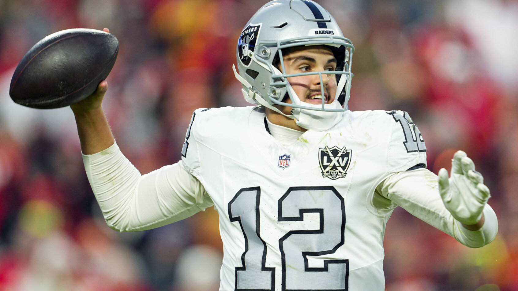 Las Vegas Raiders quarterback Aidan O'Connell throws a pass