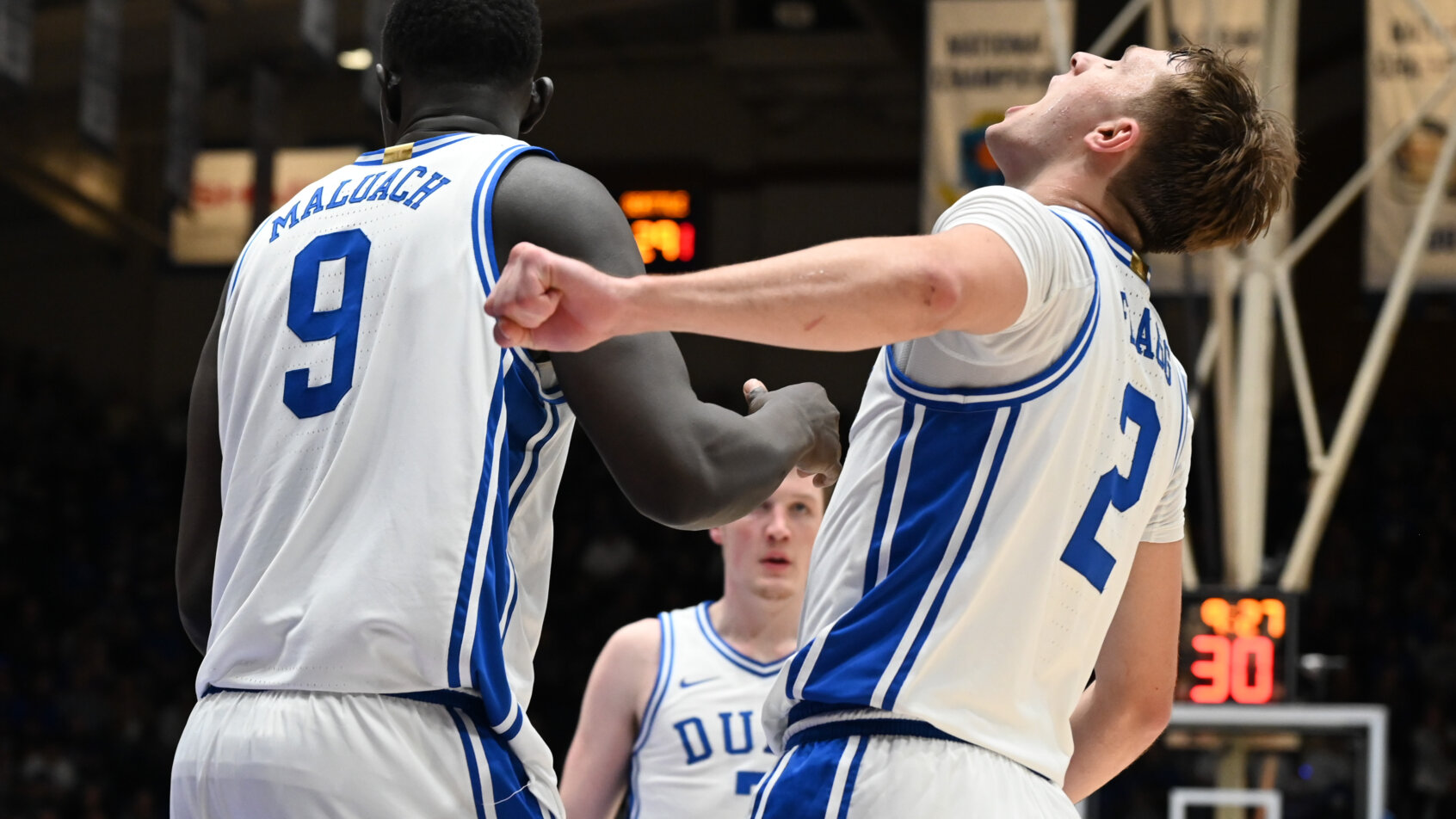 Duke Blue Devils forward Cooper Flagg celebrating a basket with teammates