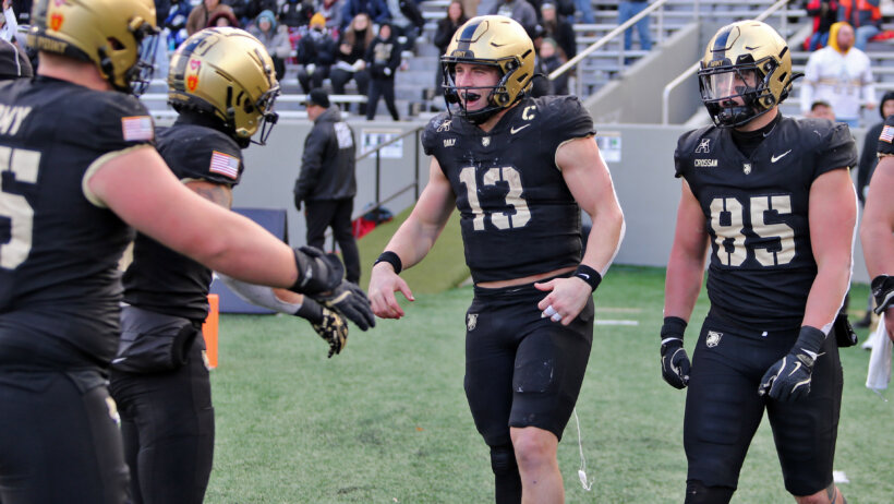 Bryson Daily celebrates a touchdown with his Army teammates.