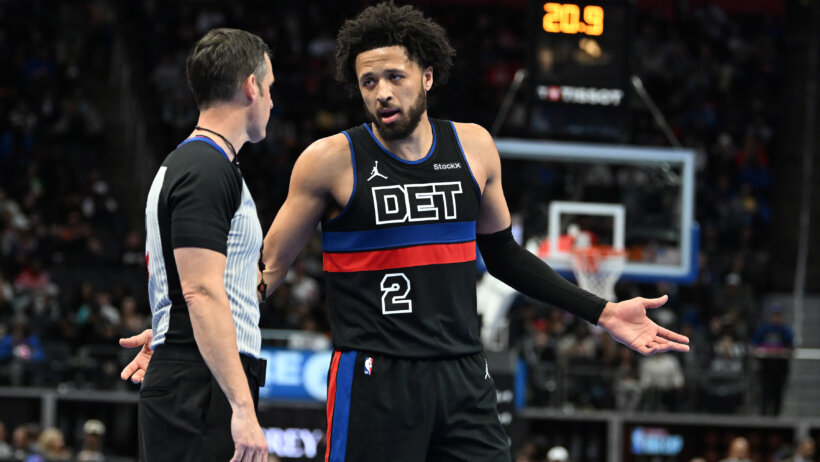 Detroit Pistons guard Cade Cunningham talking to an official